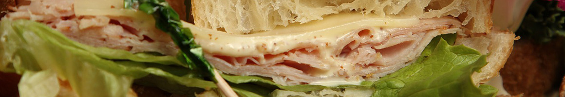 Eating Deli Sandwich at J J's Deli restaurant in Alexandria, VA.